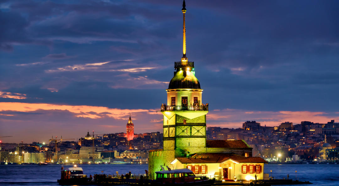 Night view of Istanbul from a yacht cruising the Bosphorus.