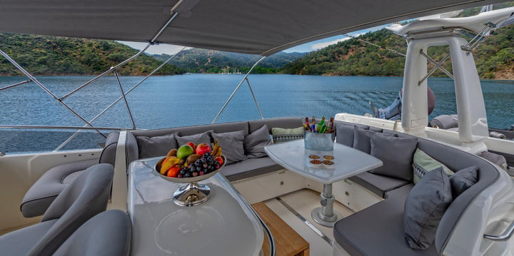 Guests enjoying bespoke yacht tour amenities as they glide through the tranquil waters of the Bosphorus.
